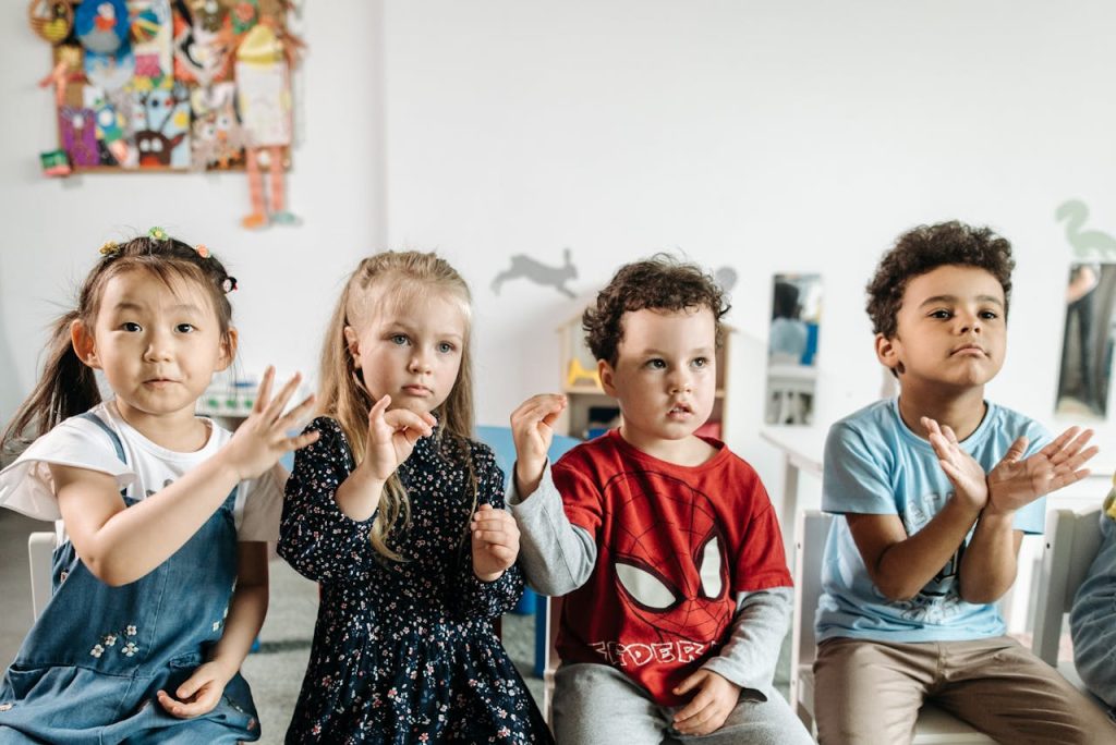 A group of diverse children engaged in a fun activity in a preschool classroom setting.